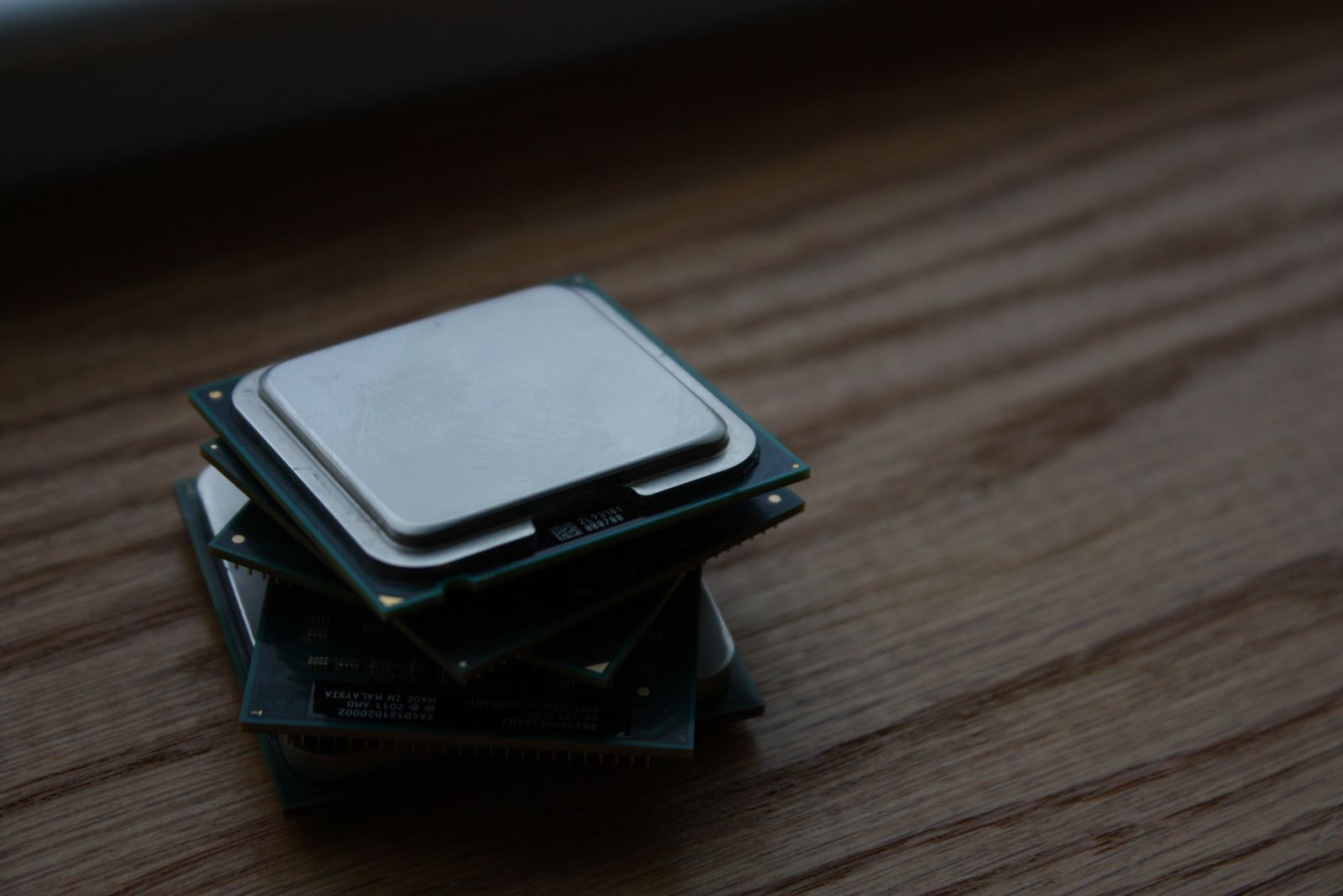 A small stack of processors on a workbench, weighed before a build