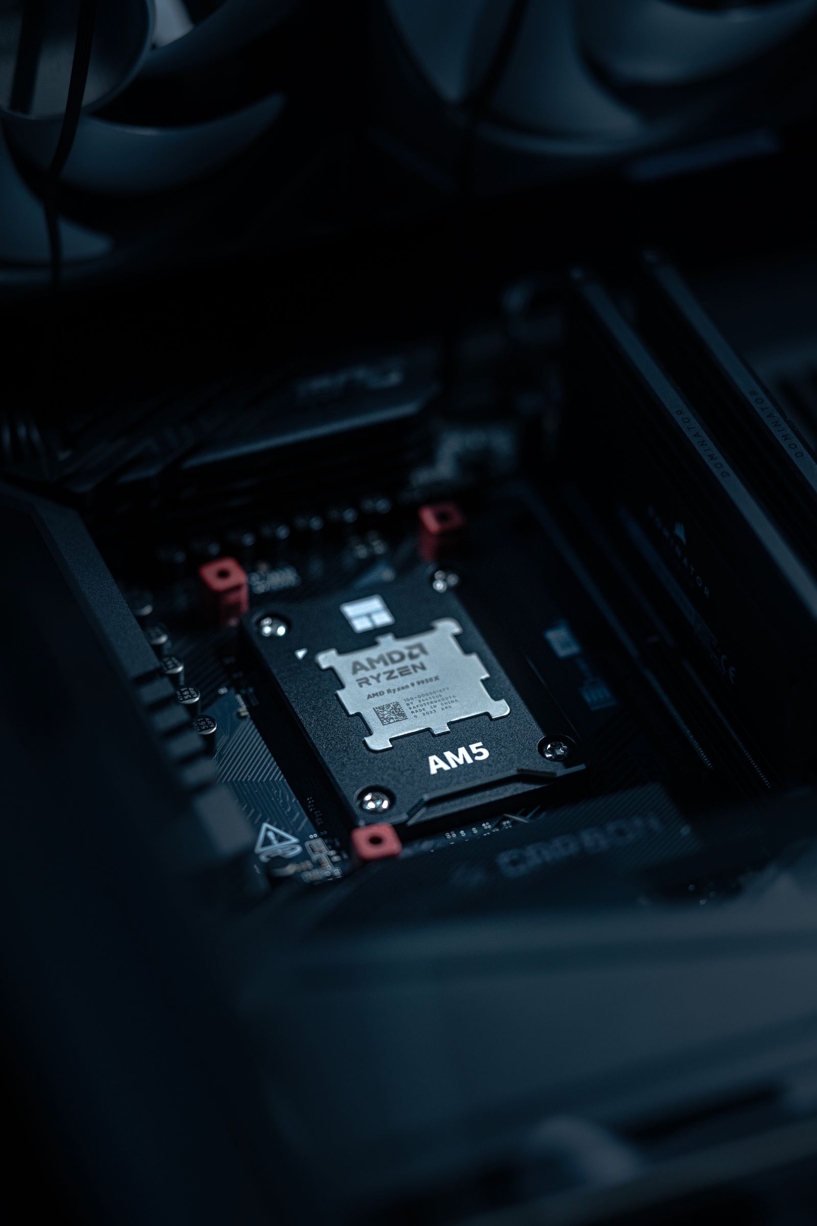 A processor exposed in its socket with the cooler pulled back, ready for cleaning and a fresh coat of thermal paste