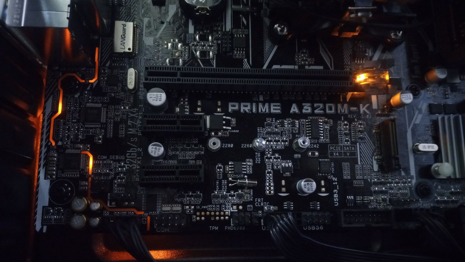 Close-up of a motherboard under diagnostic inspection