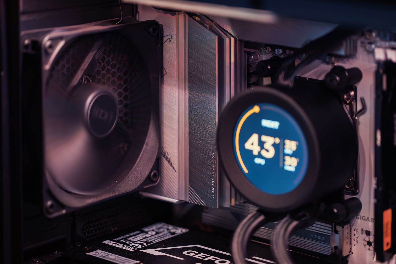 CPU cooler display showing a live temperature reading during stress testing