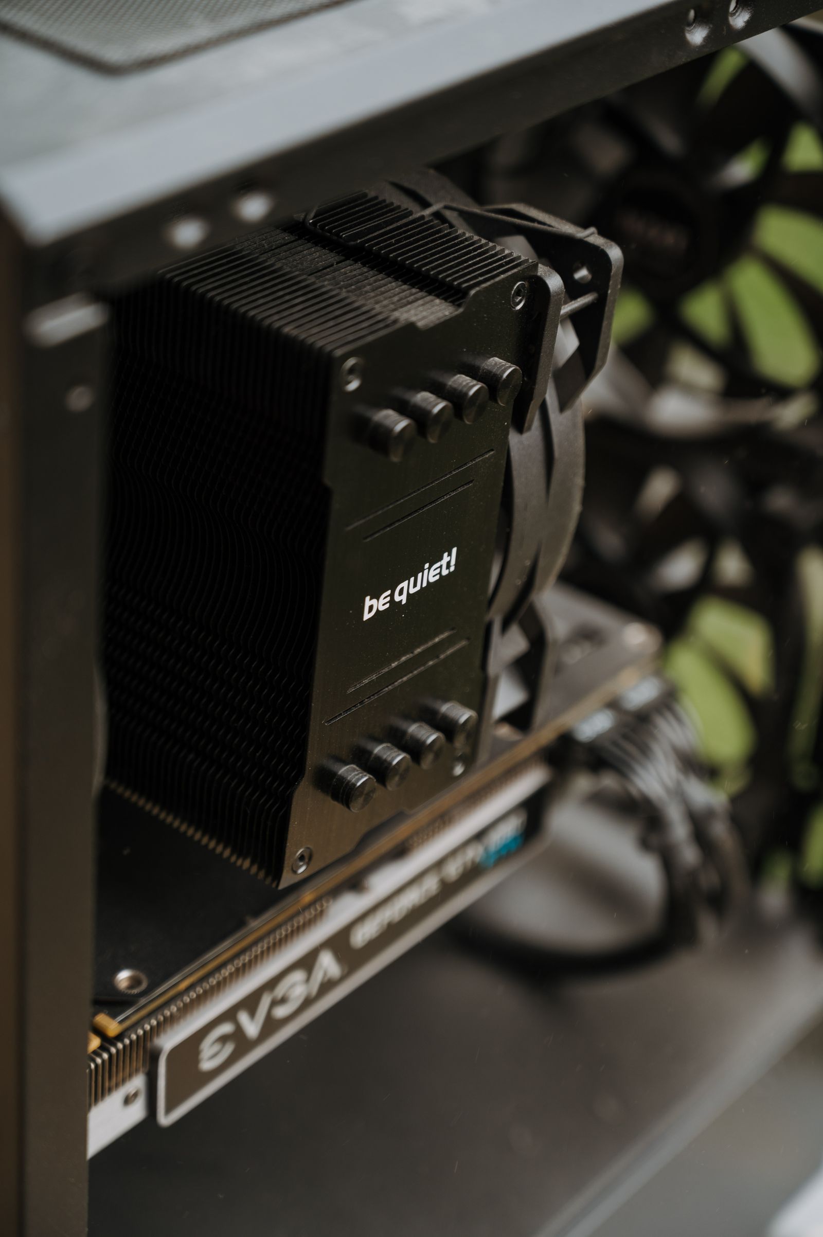 Close-up of a graphics card and cooler installed inside a PC case